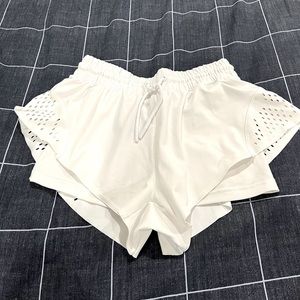 Adidas, Stella McCartney tennis or workout shorts.